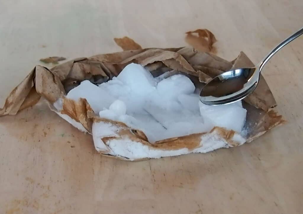 touching a metal spoon to dry ice.