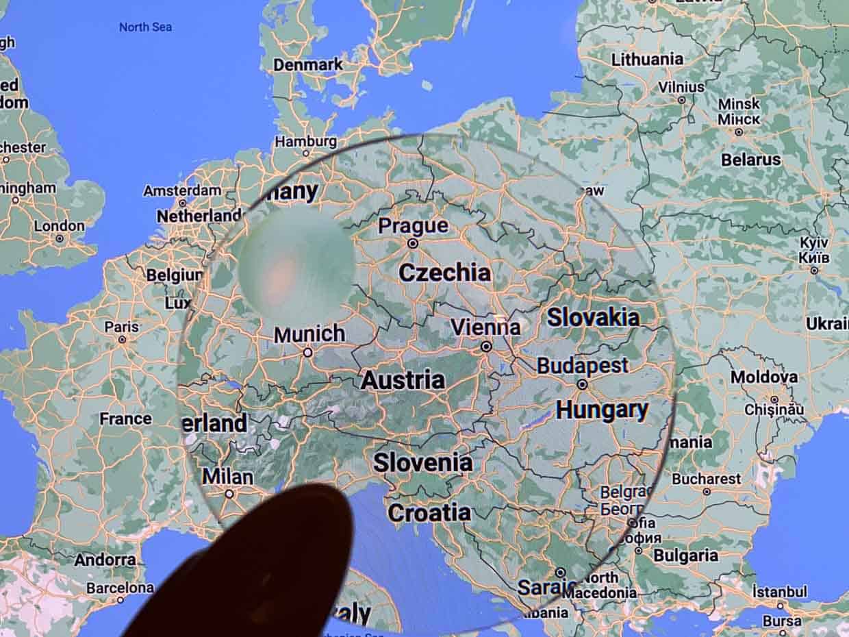 Map of Austria with magnifying glass.