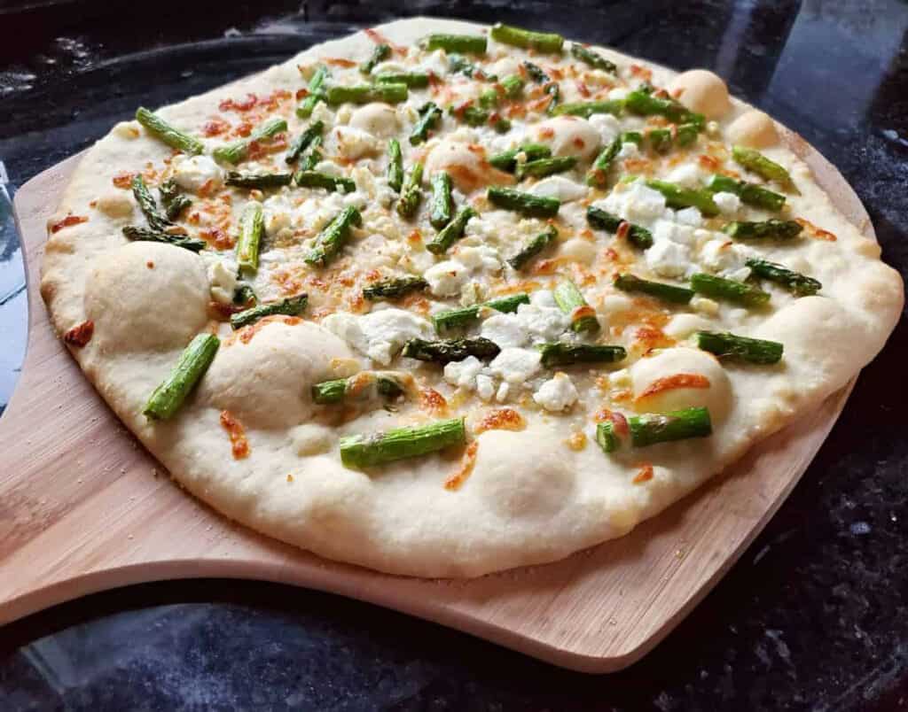 Asparagus Goat Cheese Pizza on a Pizza Peel