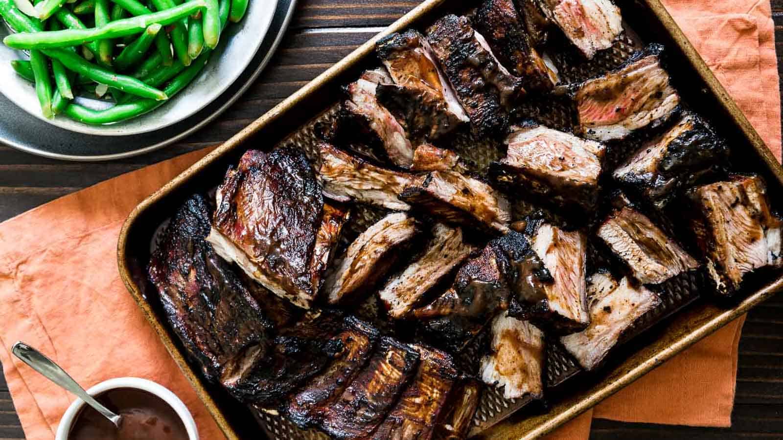 BBQ lamb ribs on a sheet pan.