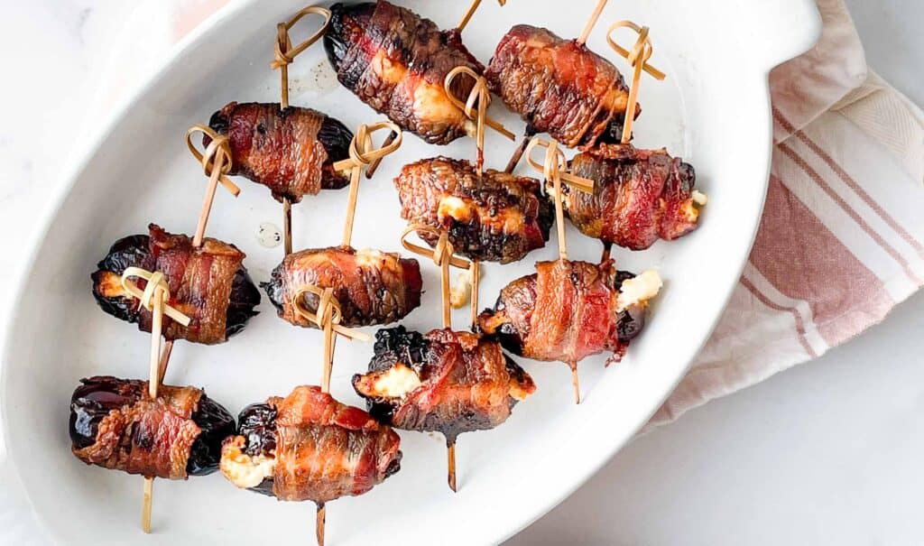 Bacon Wrapped Dates in a casserole dish. 