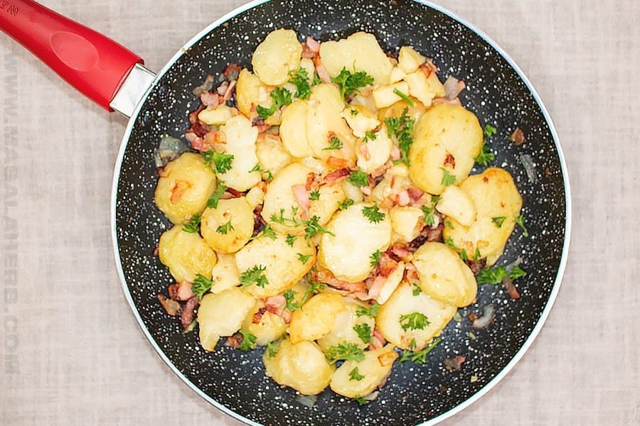 Bratkartoffeln with Bacon in a pan.