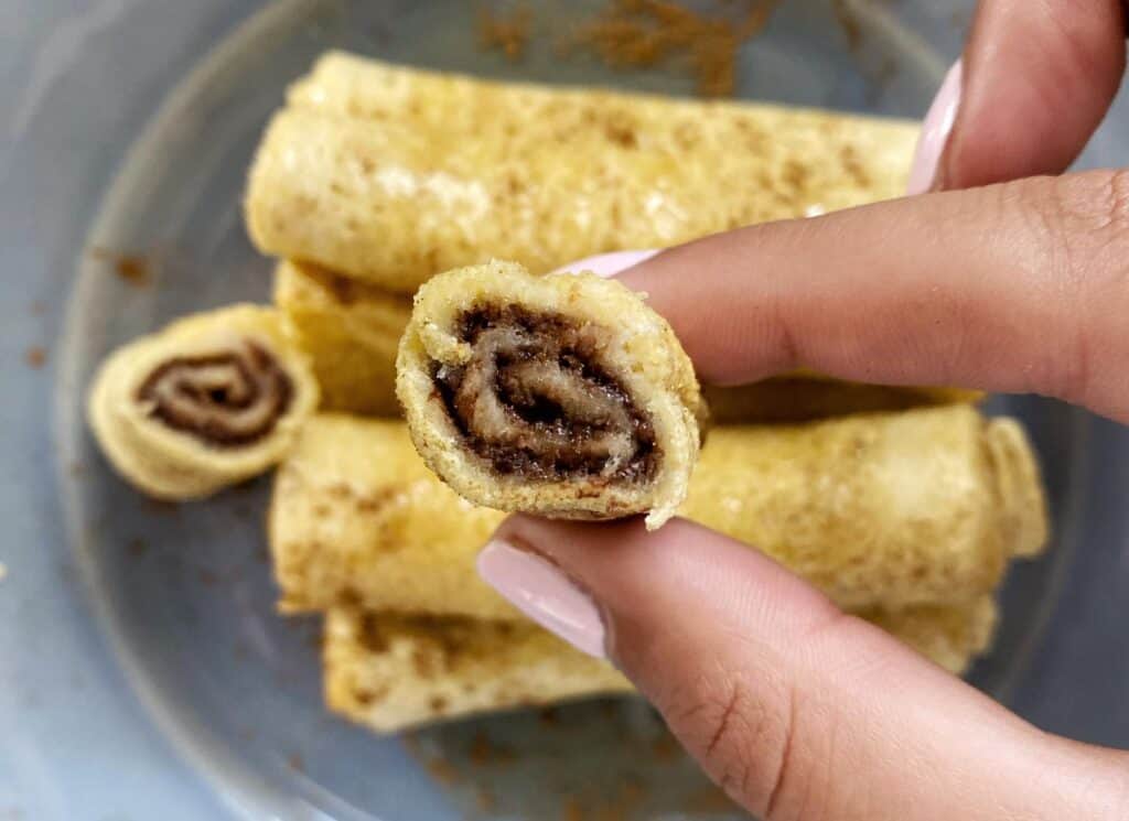 Air Fryer French Toast Roll Ups cut to show the filling.