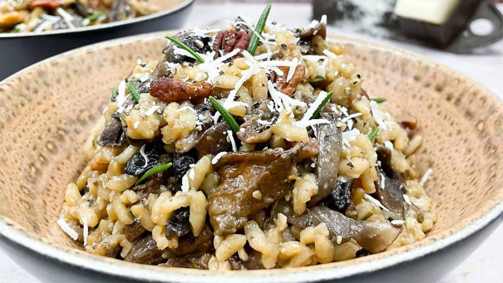 A bowl of risotto with mushrooms and parmesan cheese.