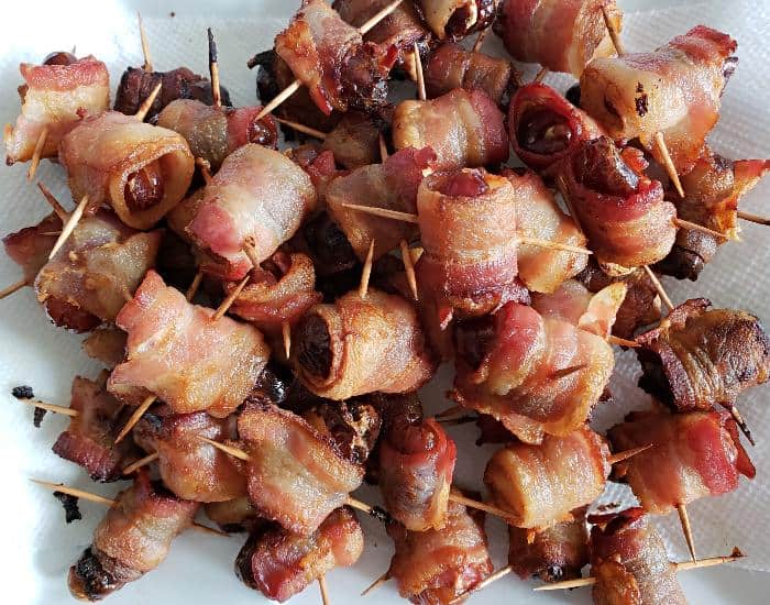 Pile of bacon wrapped dates.