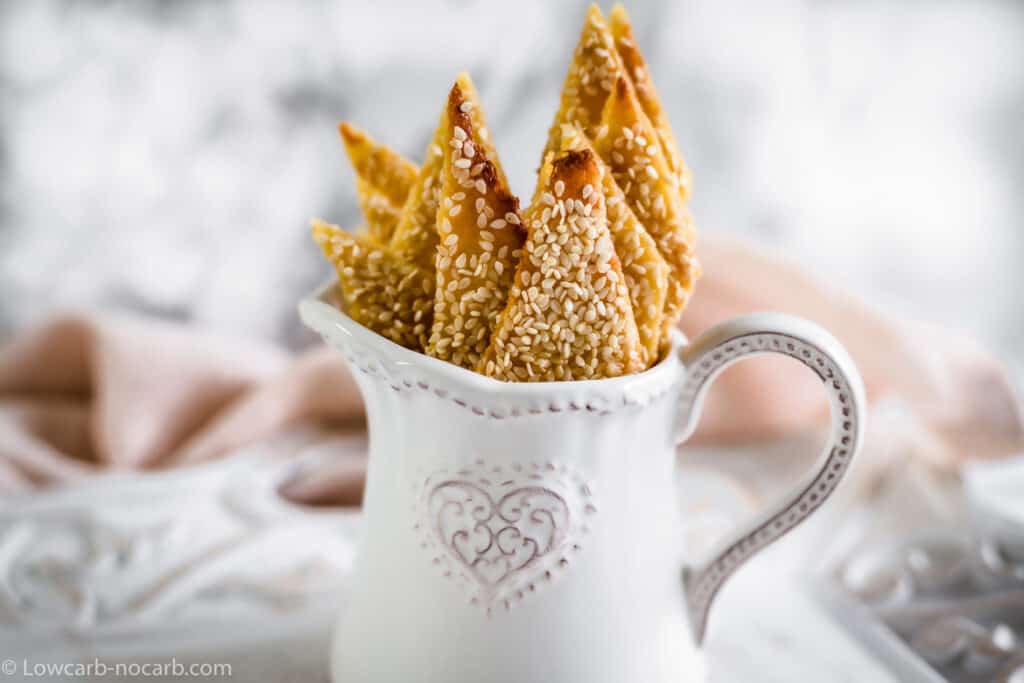 Sesame crackers in small pitcher.