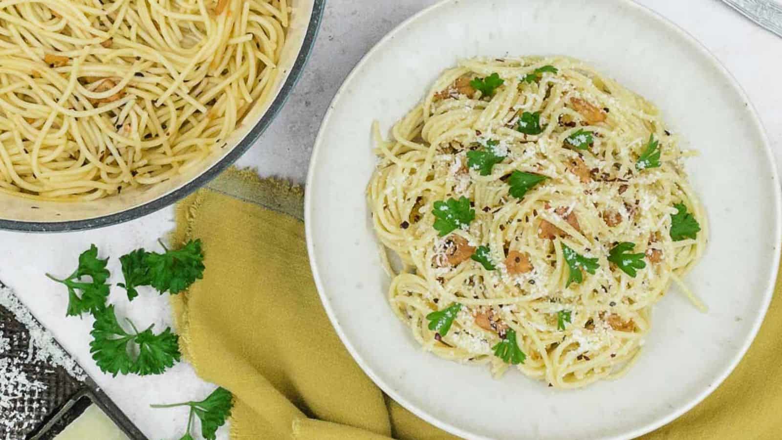 A delicious and simple pasta recipe topped with parmesan cheese and parsley.