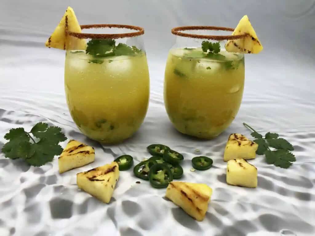Spicy Pineapple Mojito in two glasses.