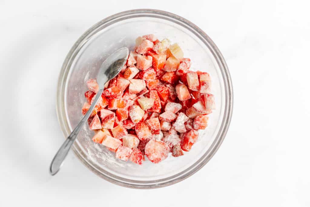 Strawberries tossed with flour ready for bread batter. 