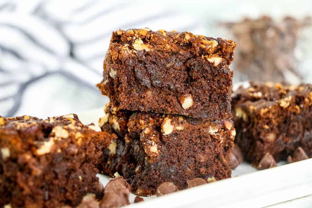 stack of Air Fryer Brownies with Caramel and Pecans.