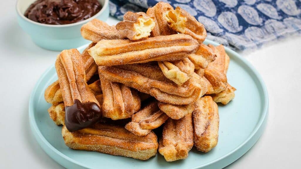 Air Fryer Churros dipped in chocolate.