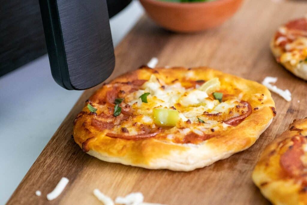 Air Fryer Mini Pizza on a cutting board.