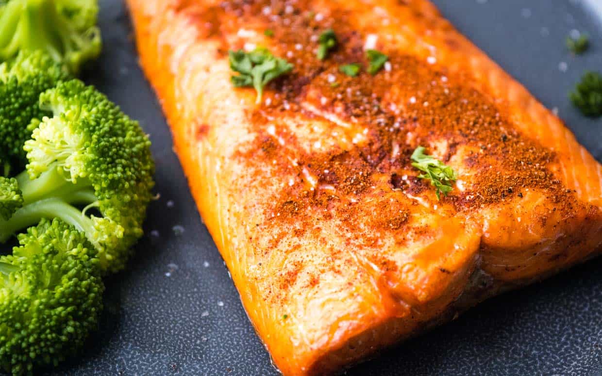 Salmon fillet with paprika and parsley after air frying.