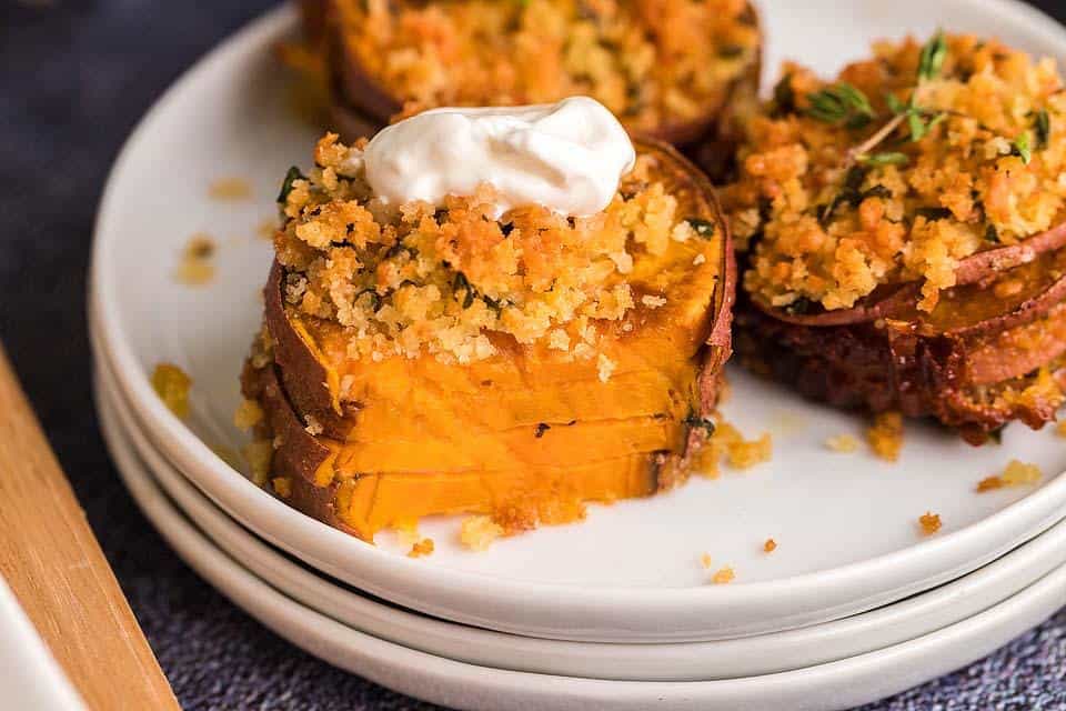 Sliced sweet potato stacks with a crumble topping.