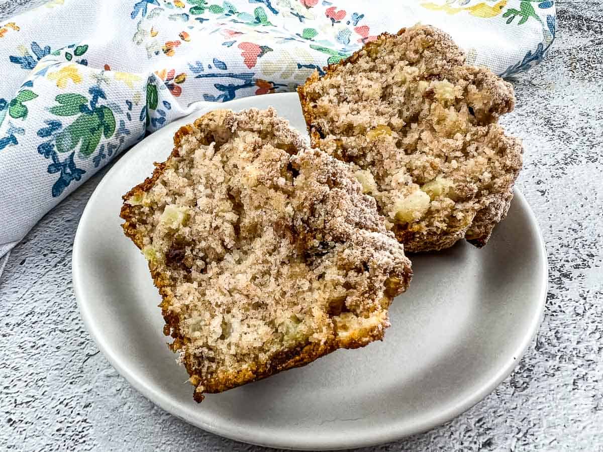 Apple, Date & Walnut Muffins on a white plate.