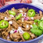 Beef Barbacoa in a blue bowl.