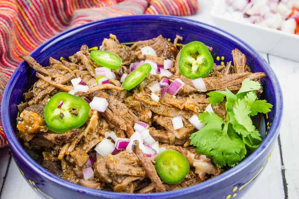 Beef Barbacoa in a blue bowl. 