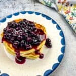 Buttermilk Pancakes with Blueberry Sauce on a plate.