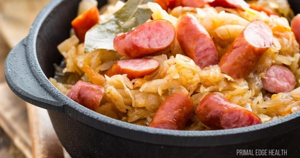 cast iron bowl with cabbage and sausage