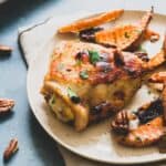 Roasted chicken thighs with sweet potatoes and pecans.