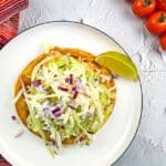 Chicken Tinga Tostada on a plate.