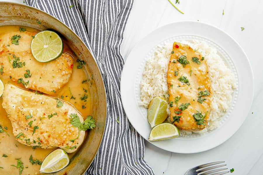 Lime chicken on a plate of rice. 