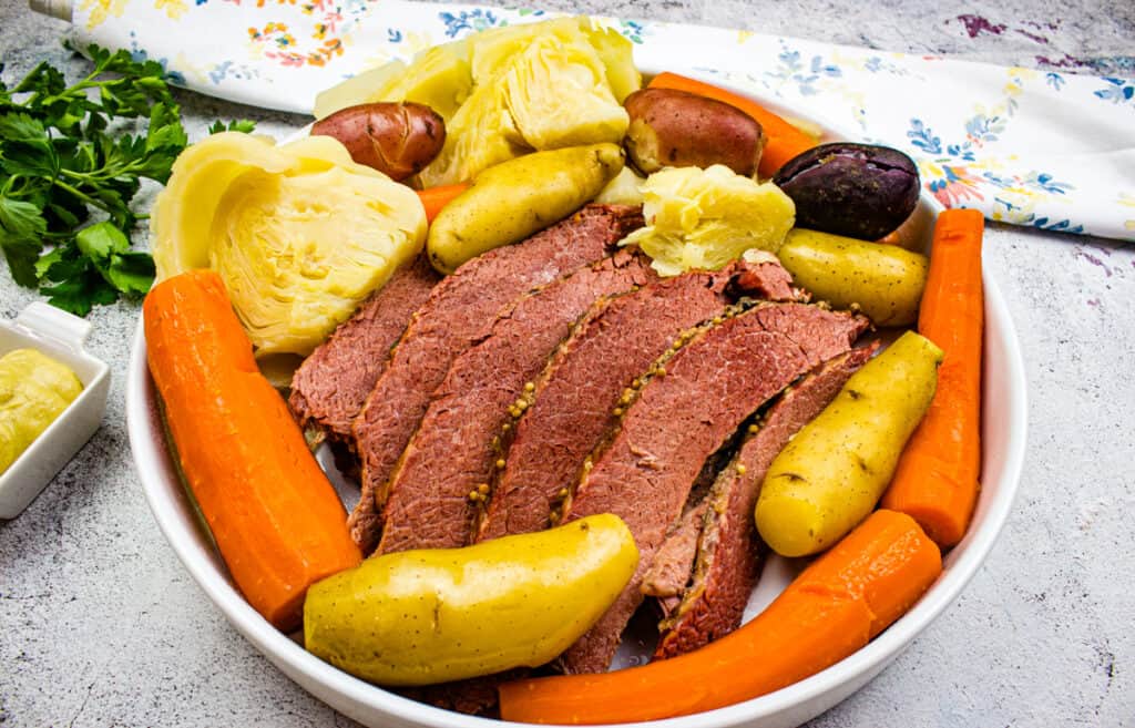 Corned beef and cabbage dinner on a plate.