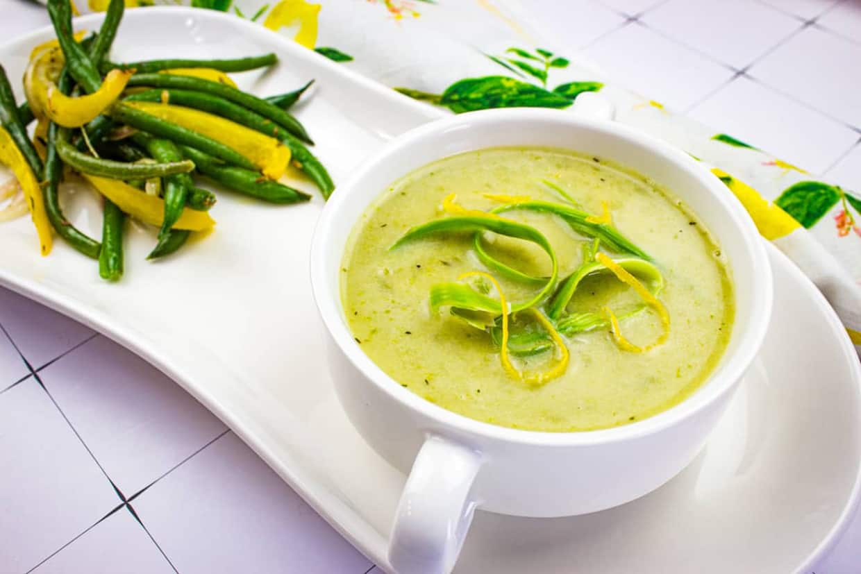 Cream of Asparagus Soup in a white bowl.