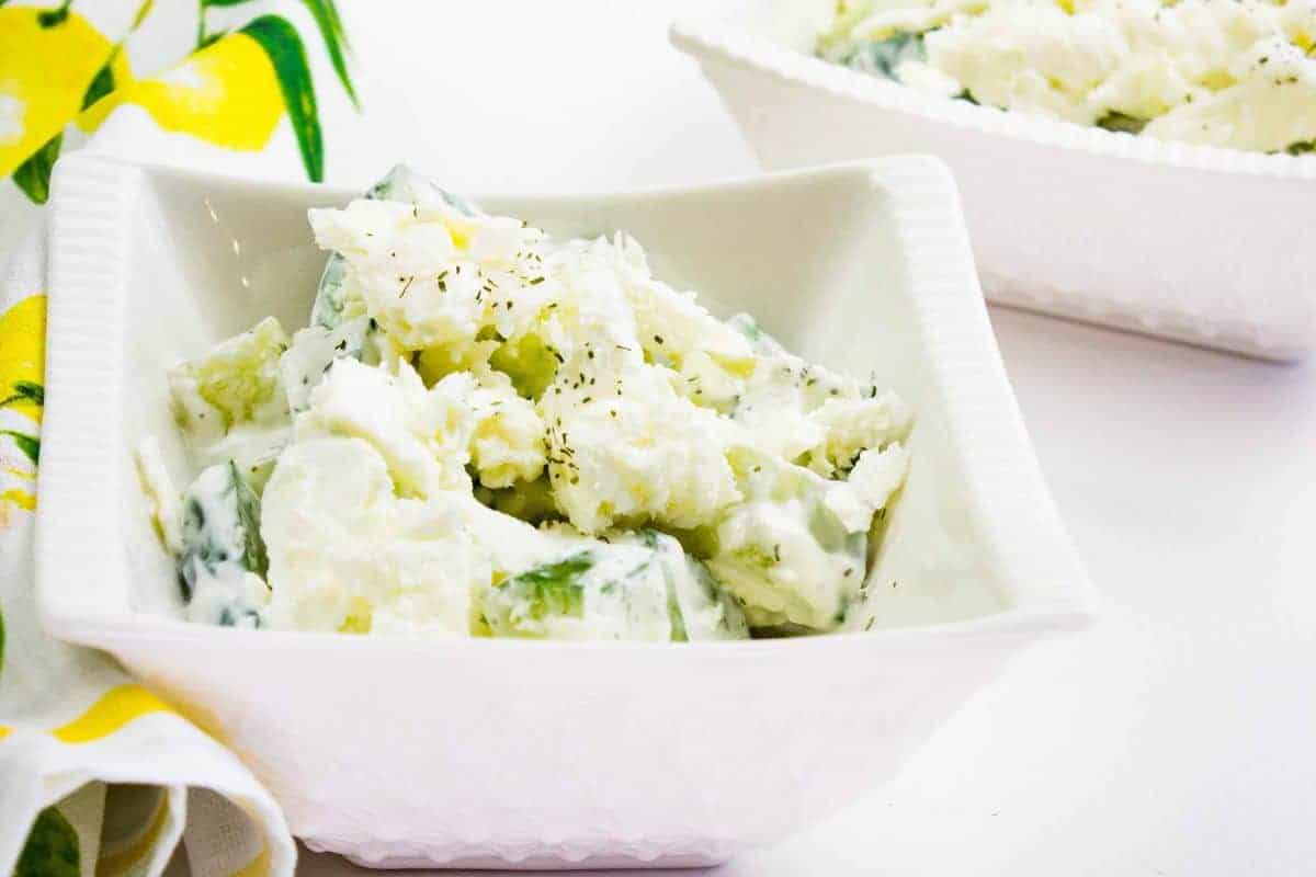 Cucumber and Feta Salad in square bowls.