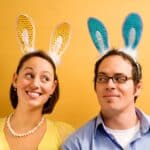 Man and woman wearing rabbit ears.