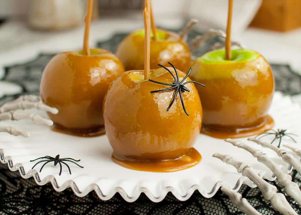 Caramel Apples decorated with spiders.
