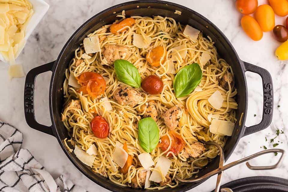 Chicken caprese pasta in a skillet.