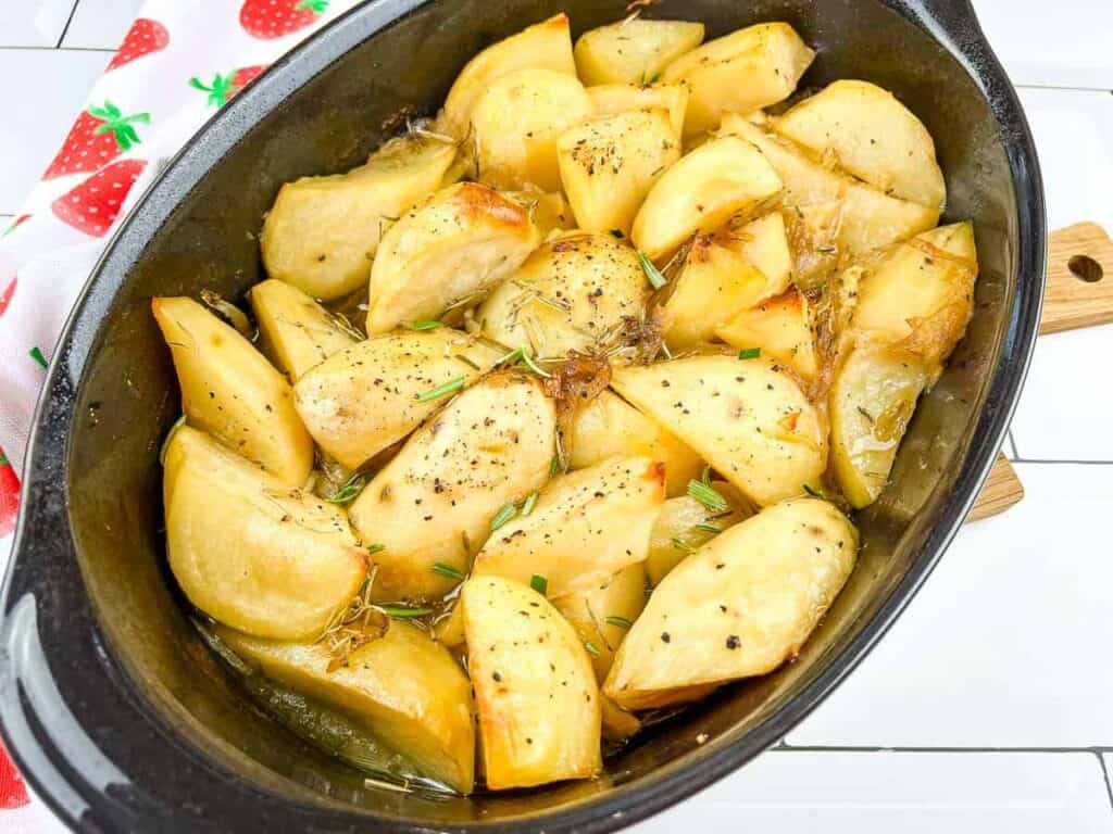 Braised potatoes in a pan after cooking.