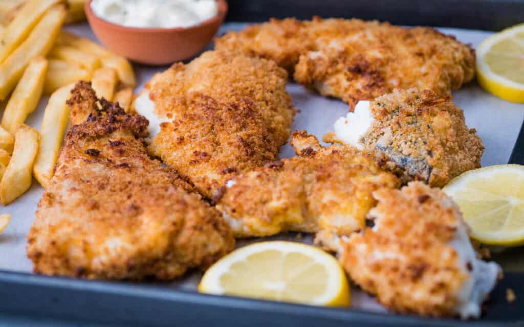 Air fried cod with breading and fries.