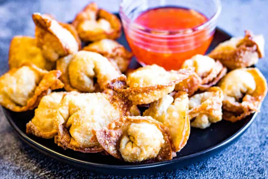 Fried wontons with dipping sauce.