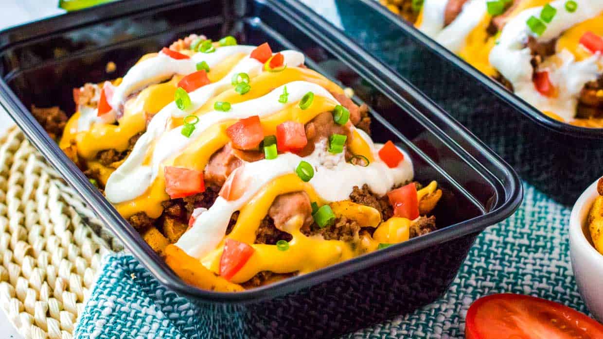 Nacho fries covered with beans and cheese.