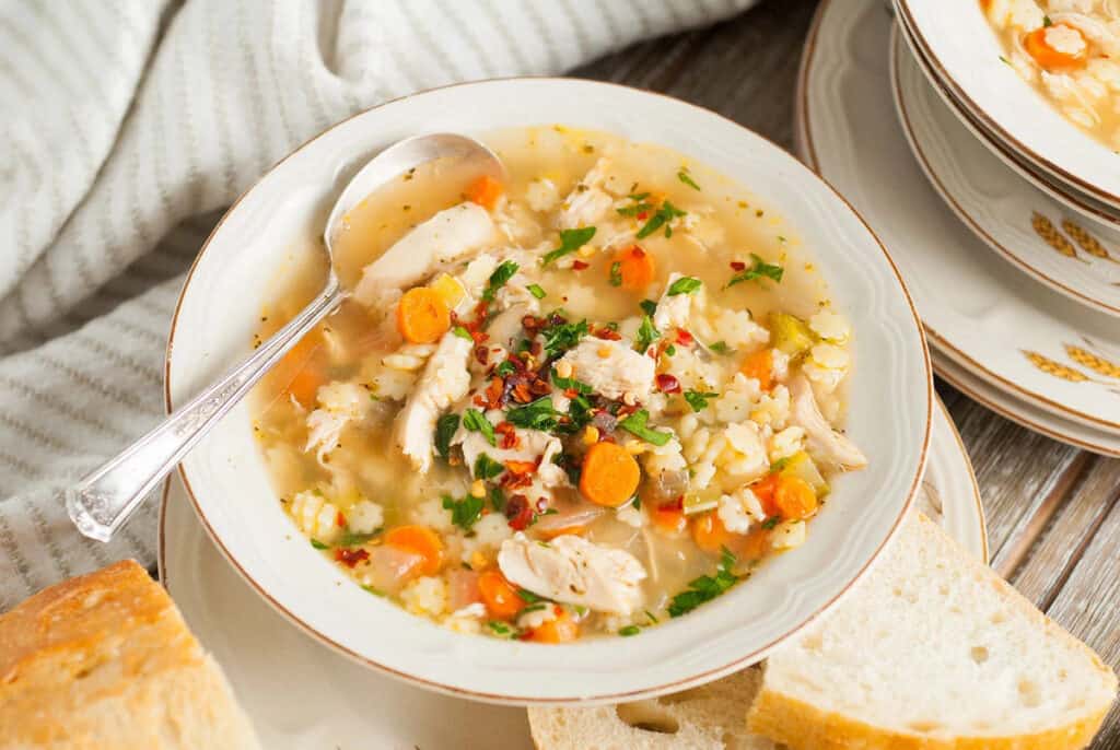 Chicken pastina soup in a bowl.