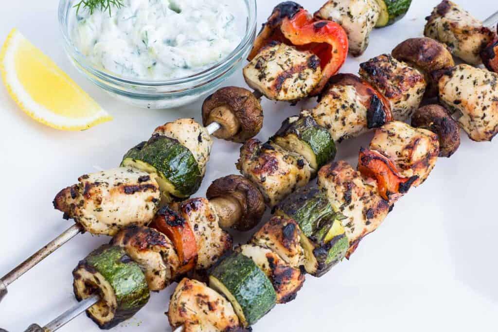 Grilled Lemon-Oregano Chicken Kabobs with a dipping sauce.