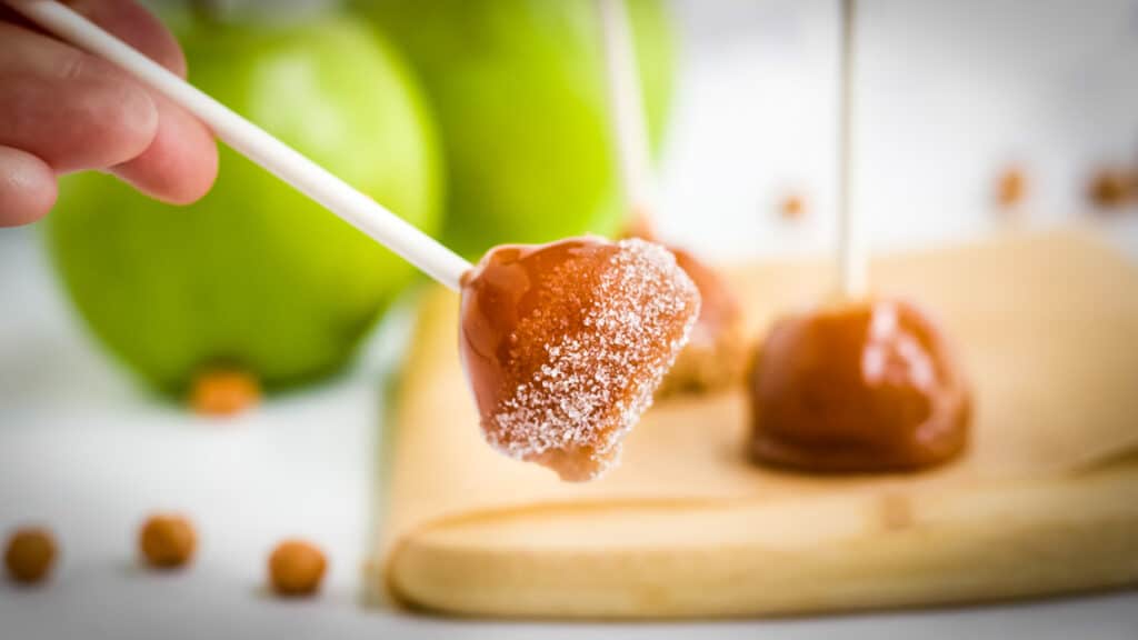 Mini Caramel Apples on a stick and dipped in sugar.