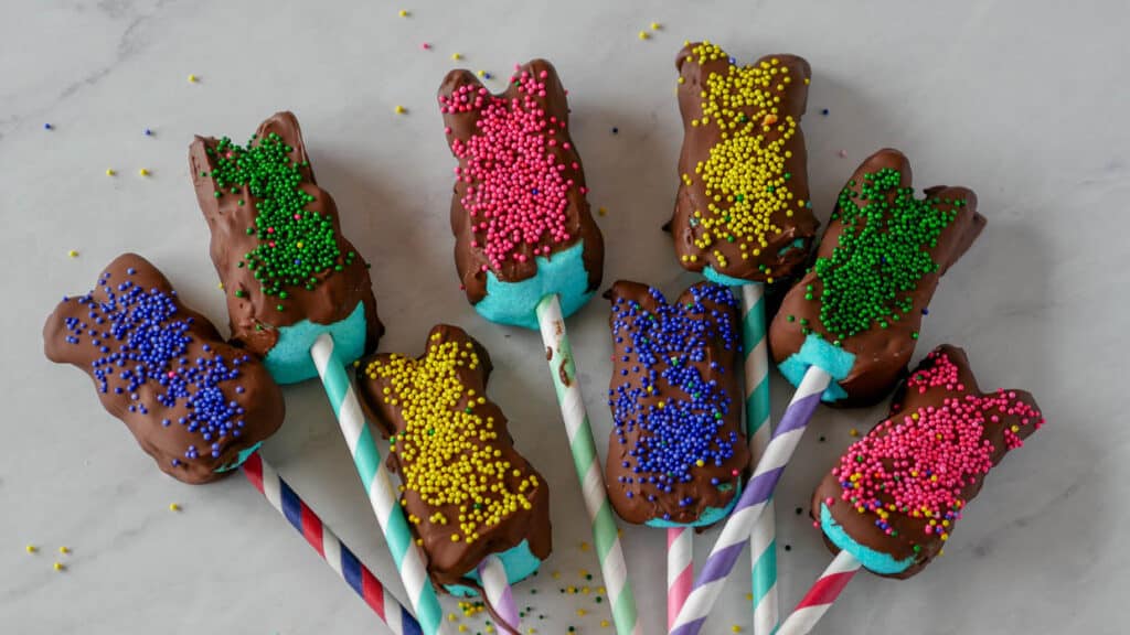 chocolate dipped marshmallow Peeps decorated with sprinkles.