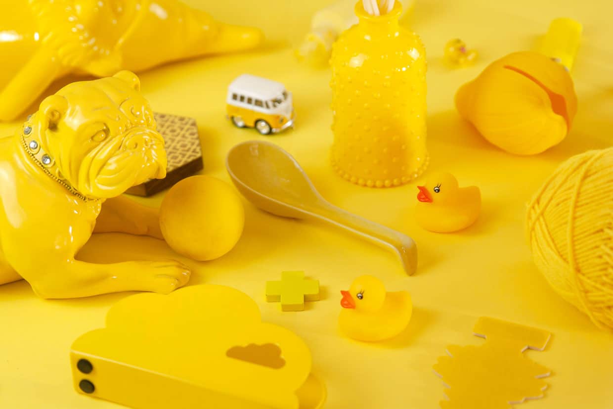 Yellow ceramic toys spread all around the image.