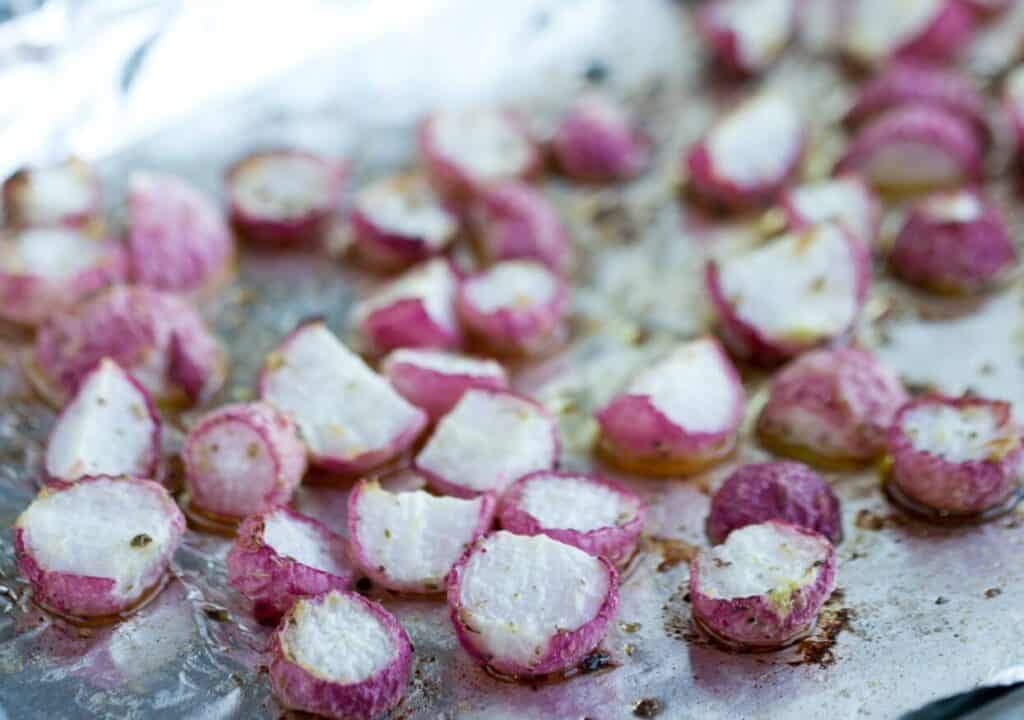 Roasting radishes on foil lined sheet pan.
