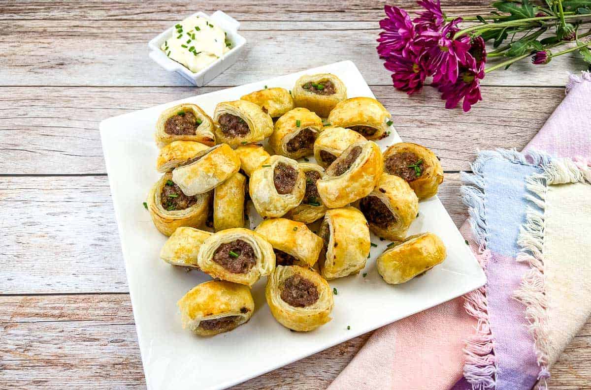 Sausage Rolls on a white plate.