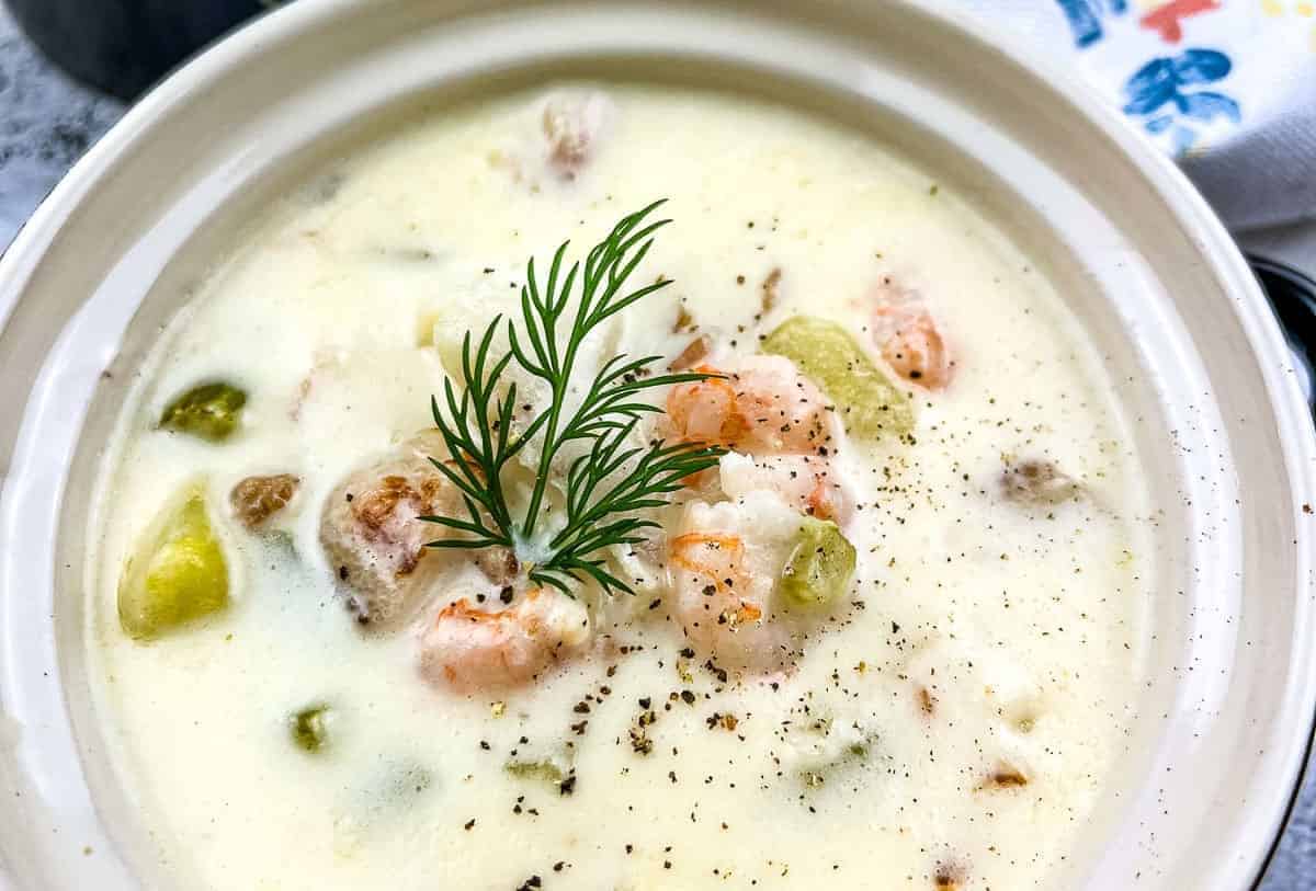 Seafood chowder with a sprig of dill, a delicious stew recipe.