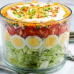 Seven layer salad in a bowl.