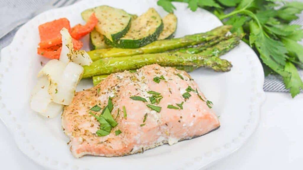 Sheet Pan Salmon and Asparagus on a white plate.