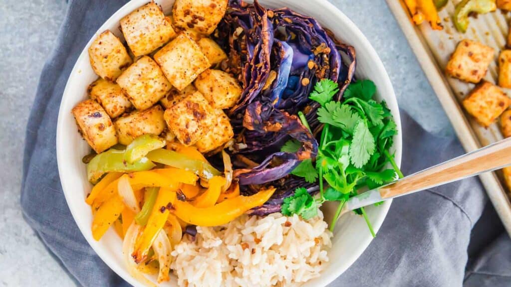Sheet pan tofu with roasted cabbage and peppers with rice.