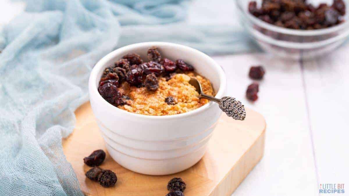 Single serve baked oatmeal in serving bowl with spoon.