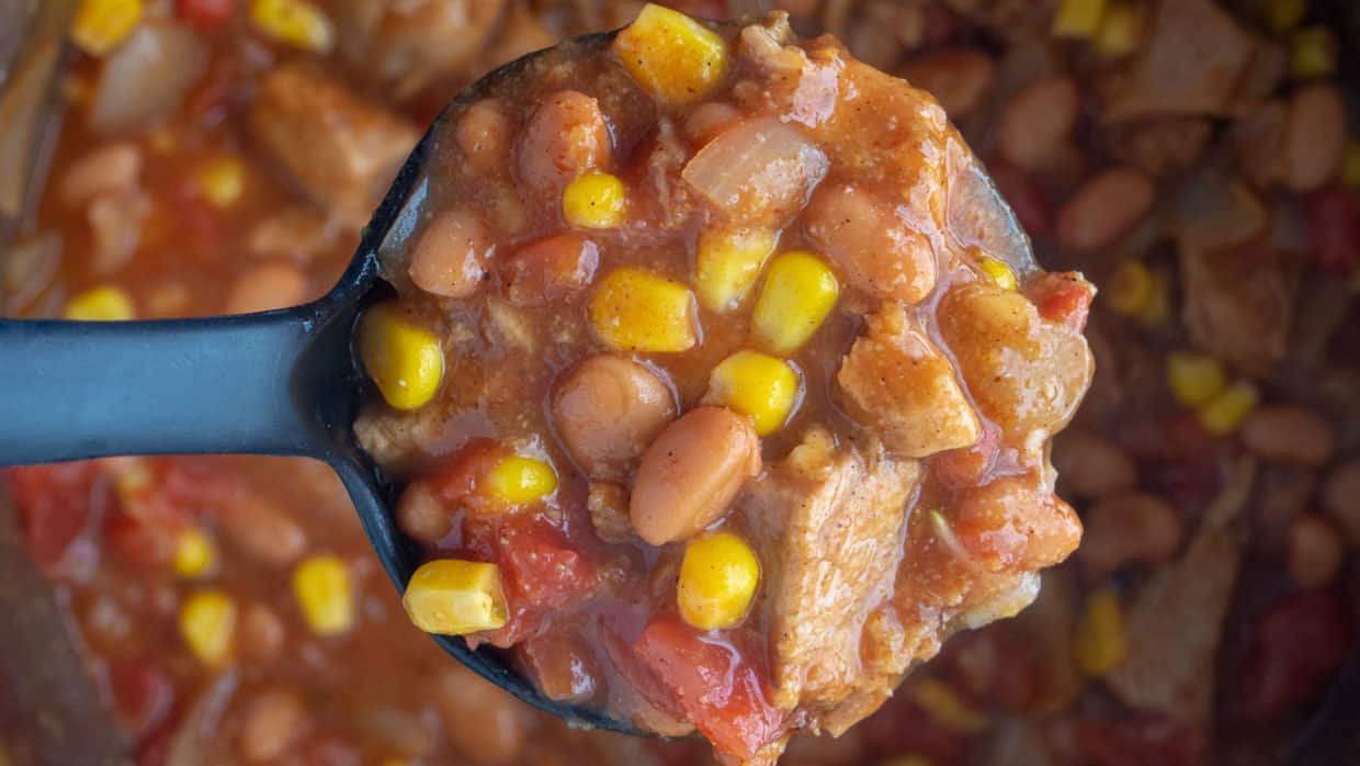 A slow cooker dinner recipe featuring beans and corn.