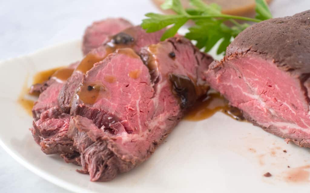 Sous Vide Beef Tenderloin sliced on a plate.